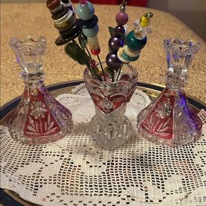 Elegant Crystal Candle Holders an a small vase with Red Accents